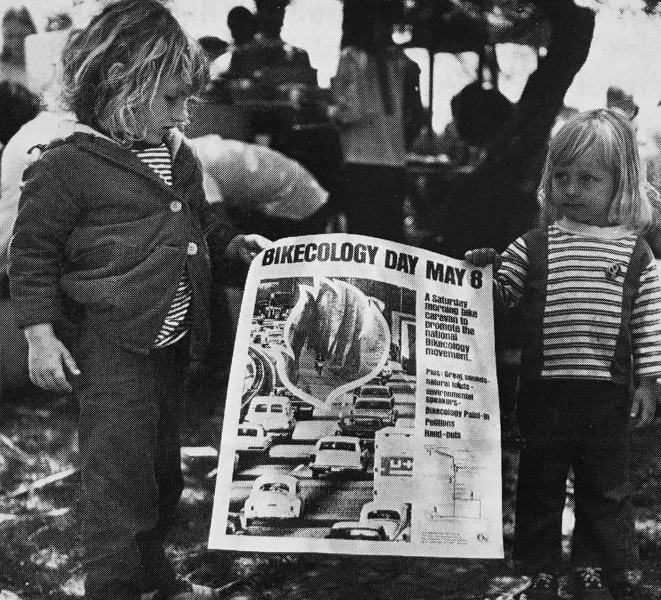 Two American children hold up a Bikeology poster mid 1970s