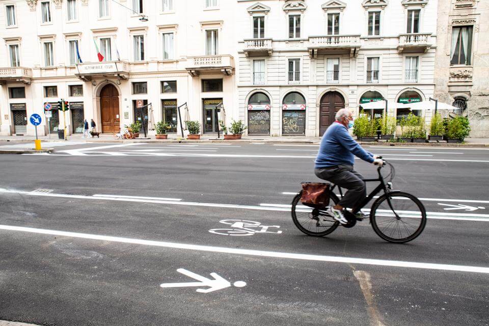 A cyclist rides along the new bike lane installed by the municipality of Milan on Corso Venezia